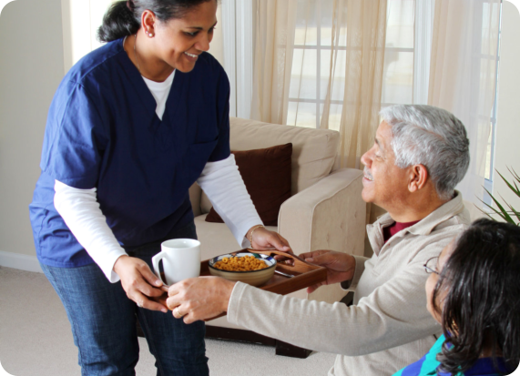 caregiver and elderly couple