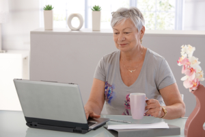 elderly woman using laptop